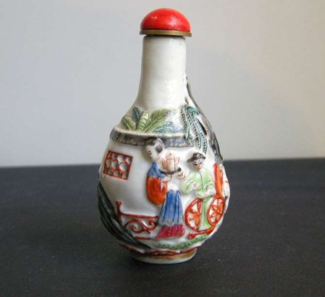 Porcelain snuff bottle in pear shape molded in polychrom with figures pavillon and horse-(Stopper in suite)